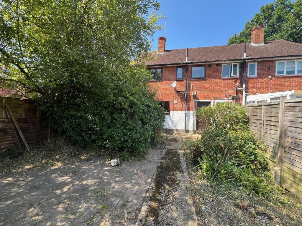 Lot: 13 - TWO-BEDROOM SEMI-DETACHED HOUSE - Rear elevation of the house looking back from the bottom of the garden